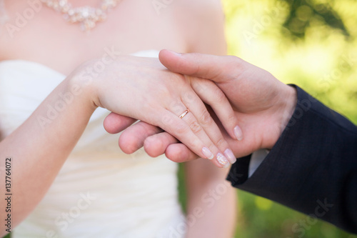 Hands of bride and groom with rings. Marriage concept