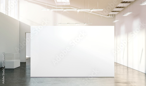 Blank white wall mockup in sunny modern empty gallery, 3d rendering. Clear big stand mock up in museum with contemporary art exhibitions. Large hall interior with wide banner exposition template.
