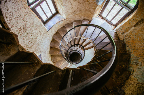Spiral staircase in an abandoned castle
