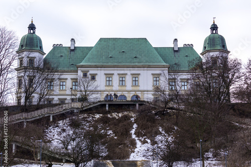 Ujazdowski Castle in late winter. City of Warsaw, Poland. The baroque style of the eastern facade of a high cliff.. photo