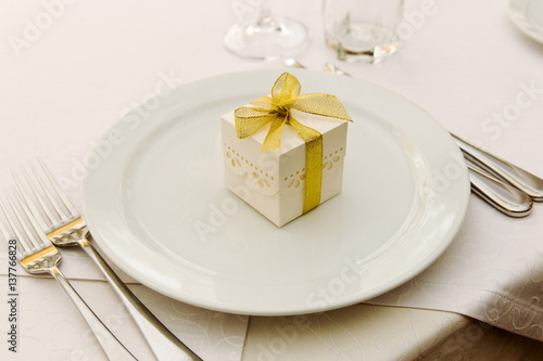 Wedding Bonbonniere on plates with gold ribbon