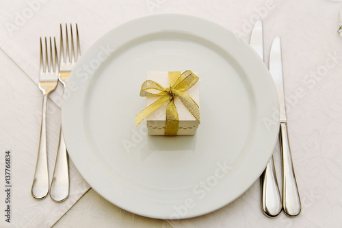 Wedding Bonbonniere on plates with gold ribbon