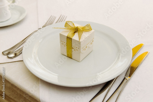 Wedding Bonbonniere with golden ribbon on plate