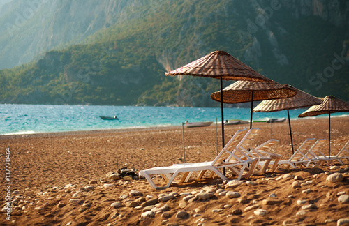 Dreamy beach with sun loungers under parasol