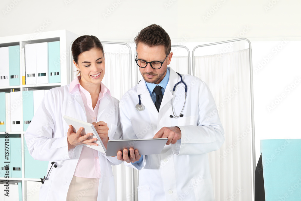Doctors using a tablet, concept of medical consulting Doctors using a tablet, concept of medical consulting