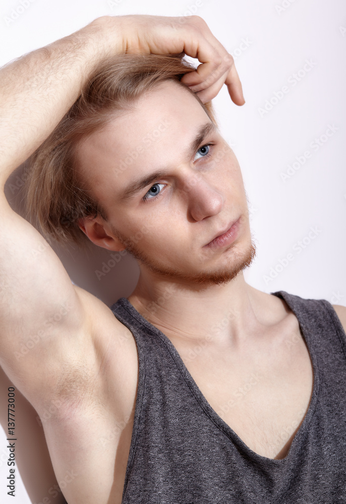 Obraz premium Young blonde man in shirt posing