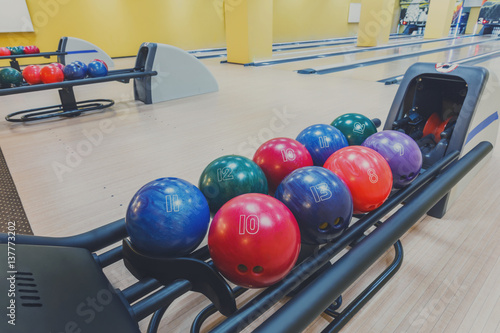 Bowling balls return machine  alley background