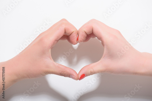 Valentines day and love concept.Two hands making heart shape on white background.