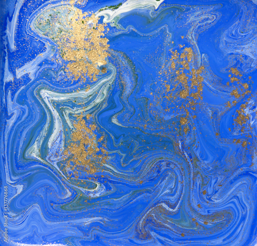 Blue and gold liquid texture. Hand drawn marbling background. Ink marble abstract pattern