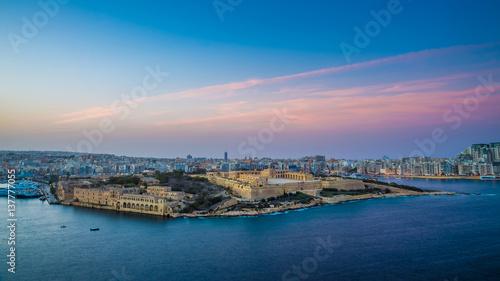 Valletta, Malta - Panoramic skyline view from the top of Valletta, the capital city of malta with Manoel Island and Sliema at sunset © zgphotography