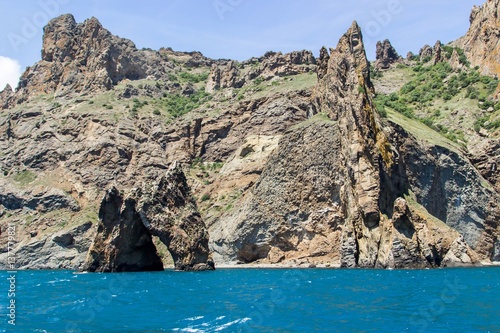 Rocky coastline of south Crimea. View from the sea  golden gates of Karadag