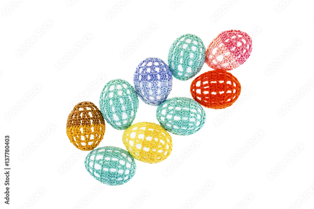 Easter eggs are in lacy multi-colored clothes isolated Easter eggs are in lacy multi-colored clothes isolated