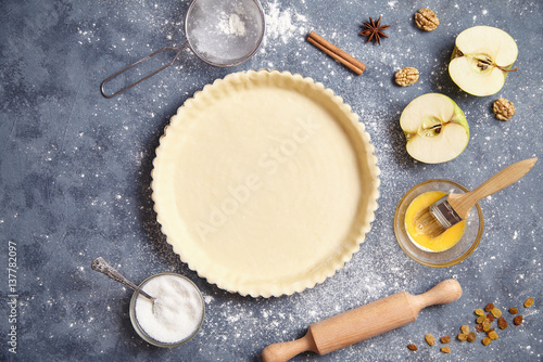 Apple pie raw American traditional dessert pastry baked food preparation recipe with ingridients flat lay