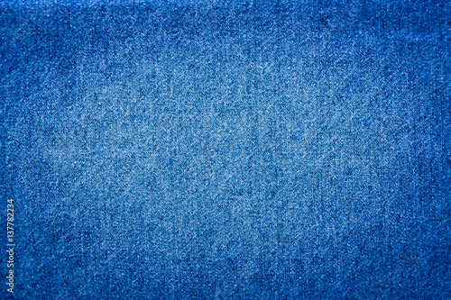 Empty Background Texture Of Blue Jeans Cloth With Vignette blurred Around.