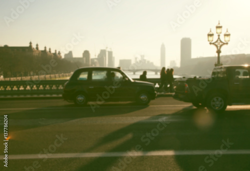 blurred background of traffic on Westminster Bridge with typical English cabs and buses, London