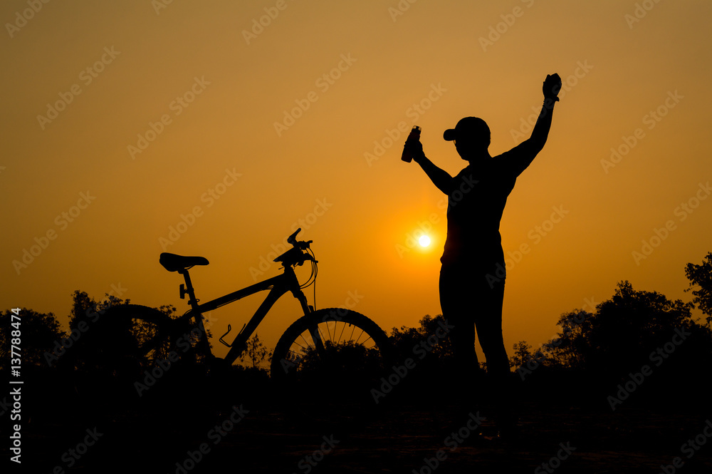Silhouettes of mountain bike with man in action something