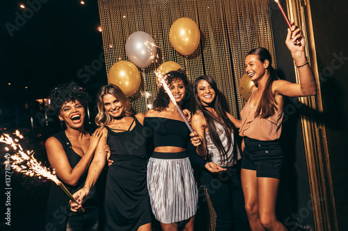 Stylish girls enjoying party at nightclub