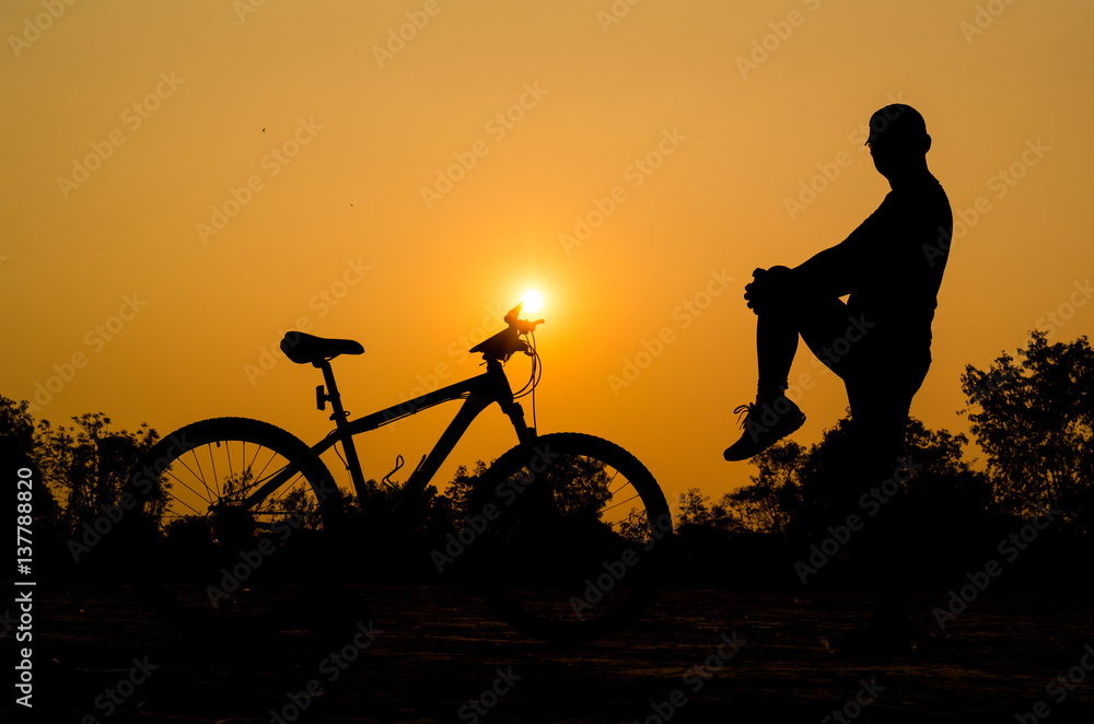 Obraz premium Silhouettes of mountain bike with man in action something