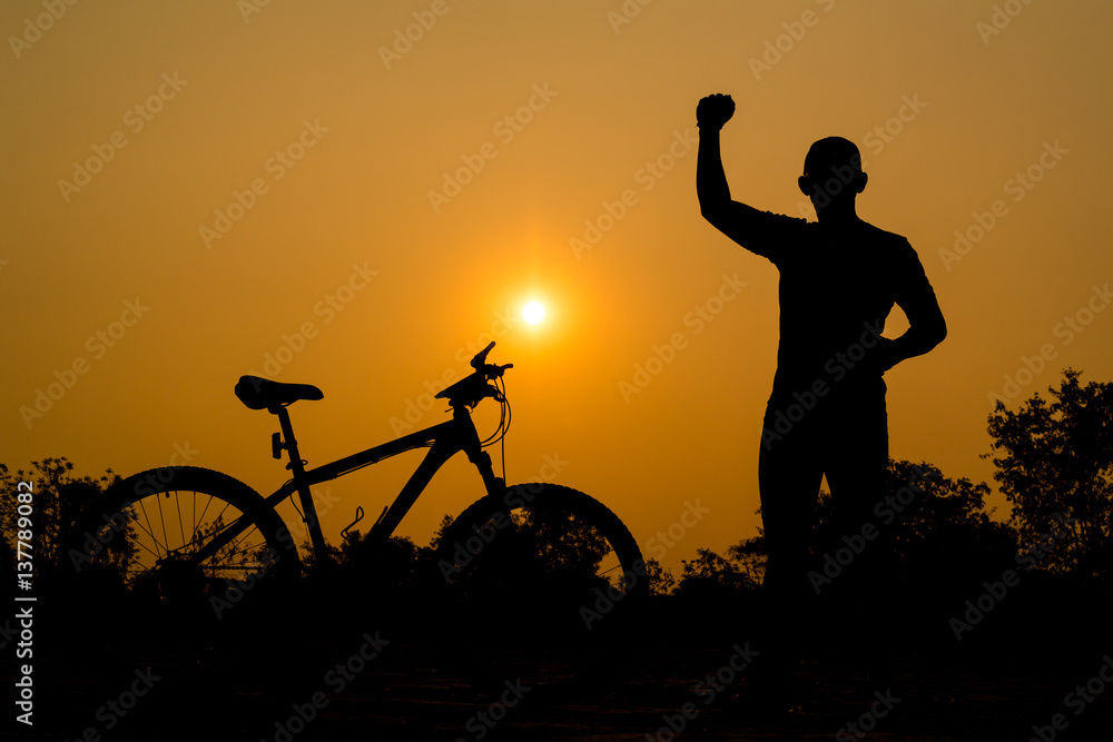 Obraz premium Silhouettes of mountain bike with man in action something