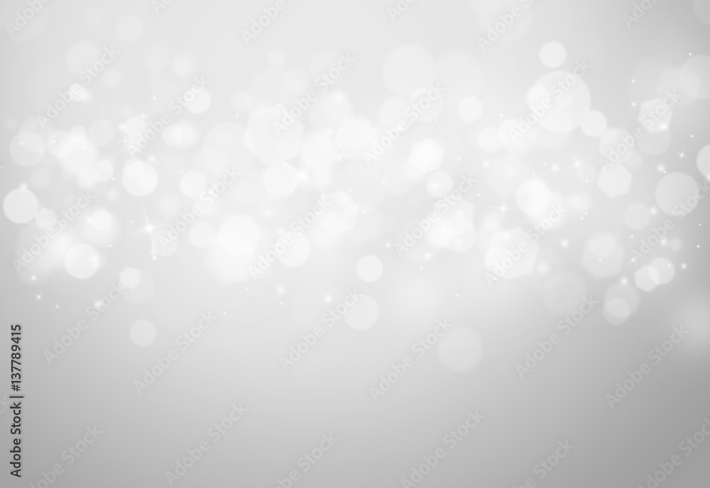 Obraz premium Grey sparkles glitter and rays lights bokeh abstract holiday background/texture.