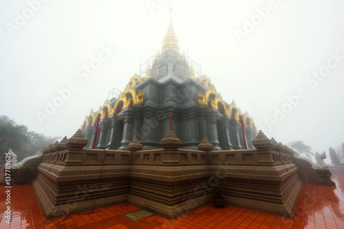 Wat Santikhiri Temple with mist photo