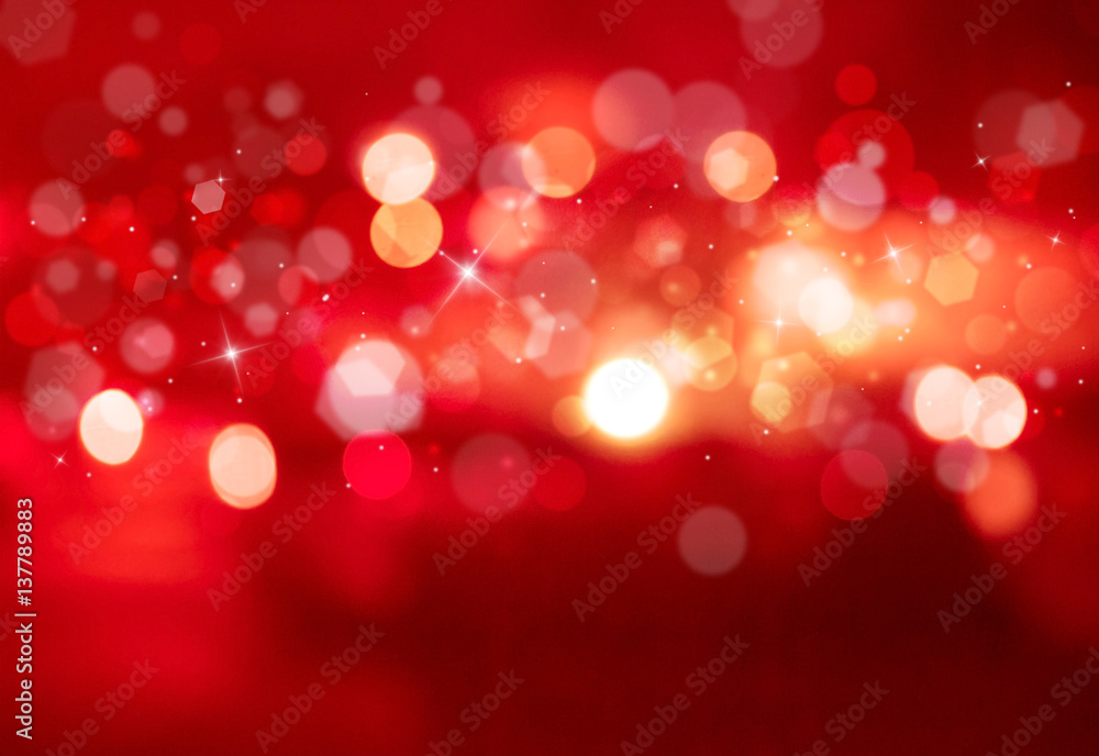 Fototapeta premium Red sparkles glitter and rays lights bokeh abstract holiday background/texture.