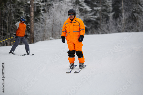Young man is skiing in mountains