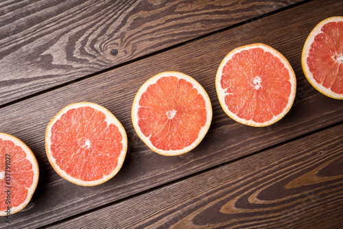 Grapefruits on wooden table. Food background