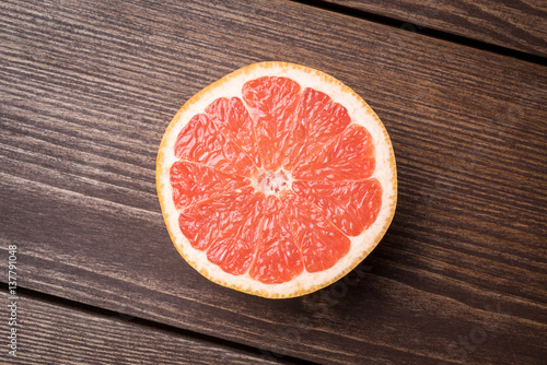 Grapefruit on wooden table. Food background