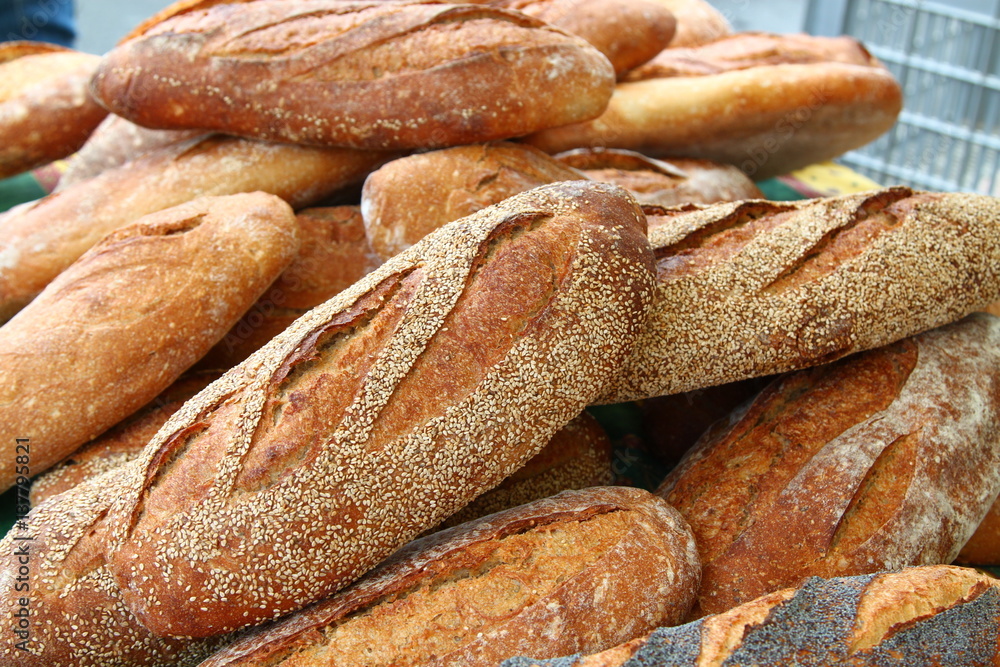 Loafs of handmade sesame bread on market in Menton, town in South France, French riviera
