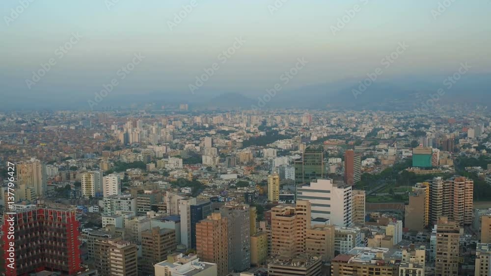 Lima Peru Aerial v64 Flying over Miraflores panning with cityscape views at sunset. Lima Peru Aerial v64 Flying over Miraflores panning with cityscape views at sunset.