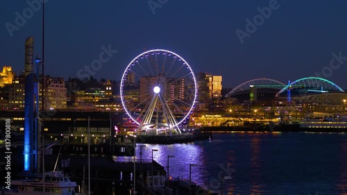 Seattle, WA - January 30, 2017. The light of downtown Seattle at night. Port of Seattle. Skyscrapers on a background of blue sky. Pier 66. City landscape video. 4K, 3840*2160, high bit rate, UHD