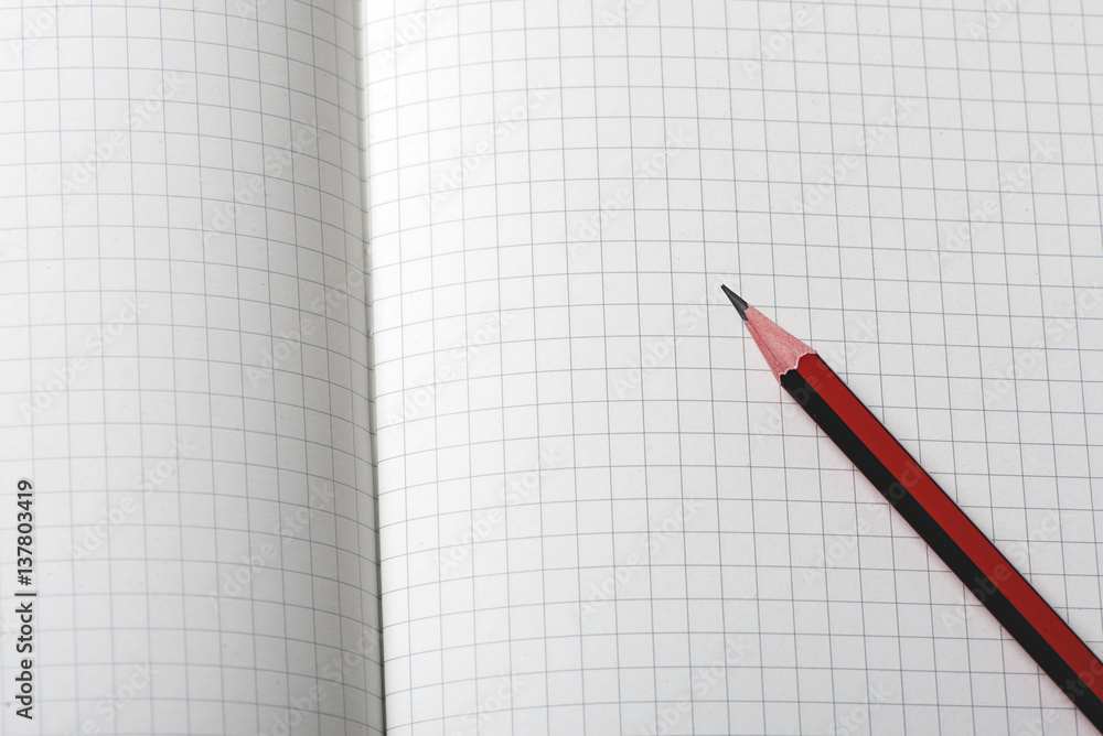 Pencil on notepad. Pencil on notepad.