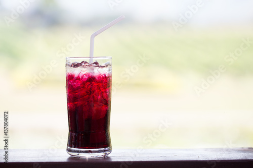 Grape juice on the table with blur background.