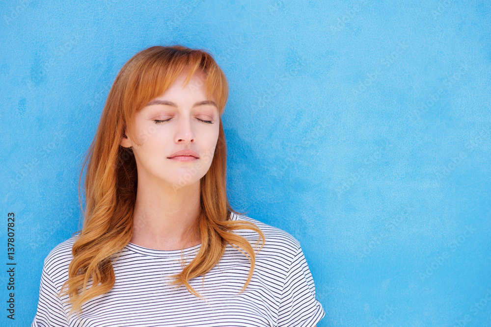 Young red hair woman with eyes closed Young red hair woman with eyes closed