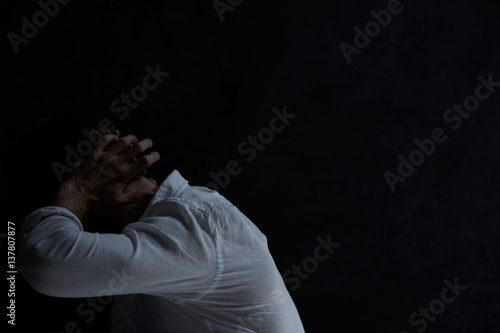 Despair man in dark room