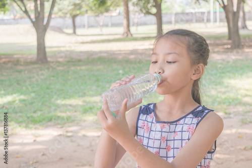 Asian girl drinking water.