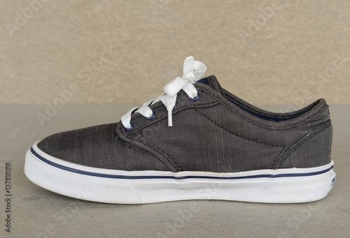 vintage style of sport gray sneaker shoe on white gray background photo