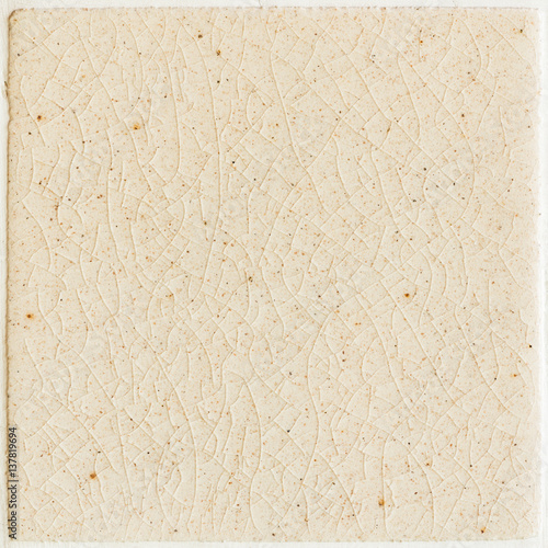 background and texture of stretch marks cracked on white cream glazed tile photo