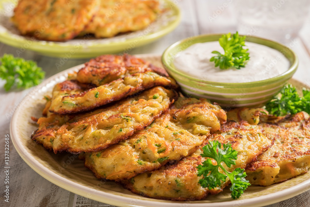 Vegetable fritters with potato, carrot, zucchini served with Ranch sauce. Vegetable fritters with potato, carrot, zucchini served with Ranch sauce.