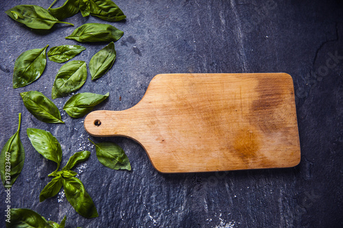 basil leaves on food background with kitchen desk