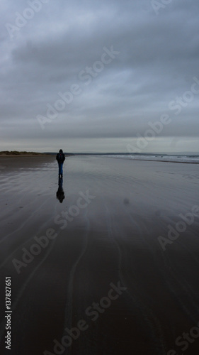 Single Person walking at beach