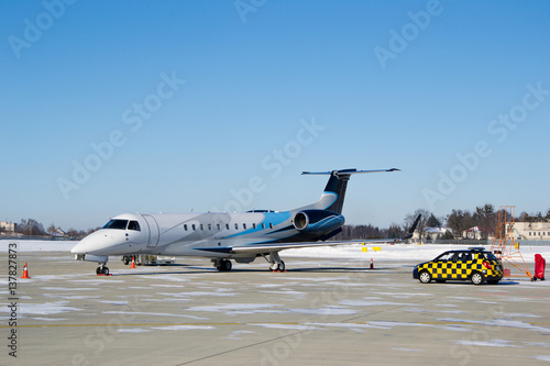 Private business jet and follow me car