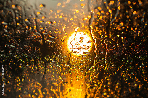 rain and sunset outside the window