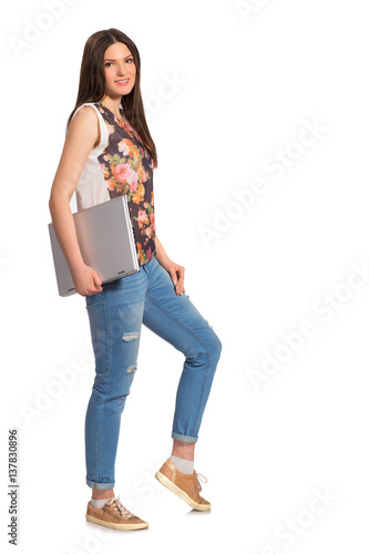 Smiling girl, with laptop full height