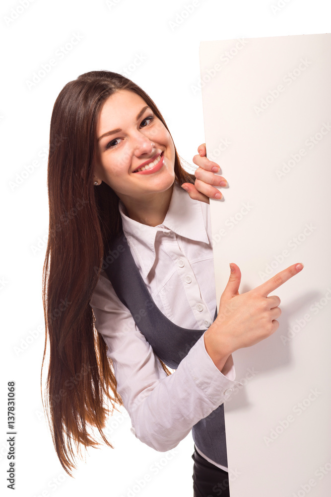 Young smiling woman pointing on blank board Young smiling woman pointing on blank board