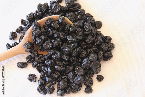 Blueberries on a wooden spoon
