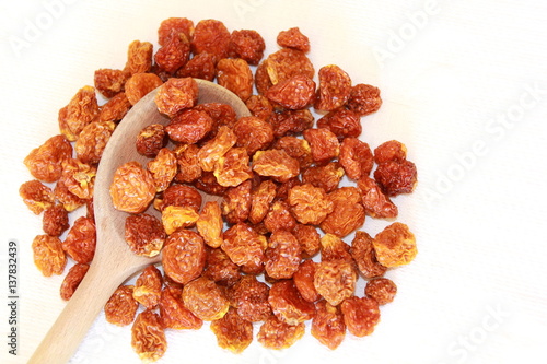 Dried Physalis on a wooden spoon