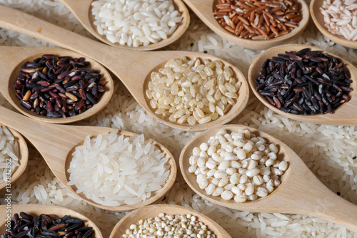 Different rice collection in wooden spoon