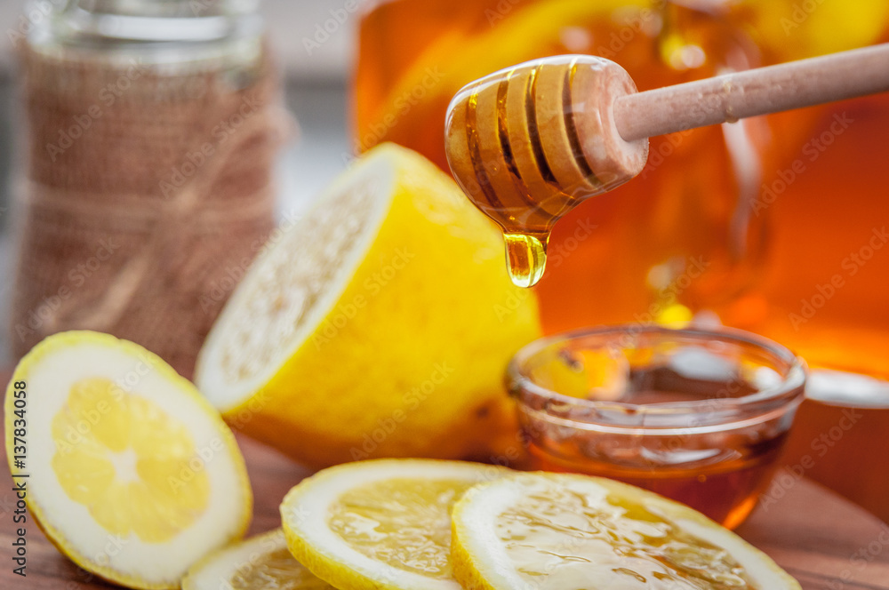 Hot tea with lemon and natural honey, good treat to have vitamins and strong immunity. Hot tea with lemon and natural honey, good treat to have vitamins and strong immunity.